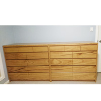 Side by side Blackbutt bedroom drawer cabinets,featuring shaped drawer pulls. 