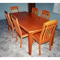Flooded Gum Dining Table and 6 Chairs. Chairs have tapered front legs and shaped crests to match the table.  